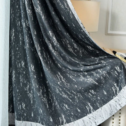Tenda oscurante grigia con effetto materico