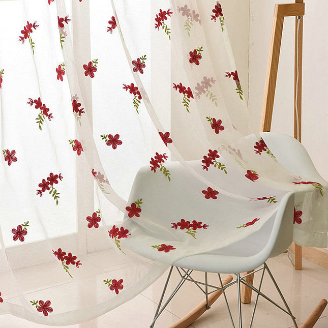 Voile ricamato con piccoli fiori rossi