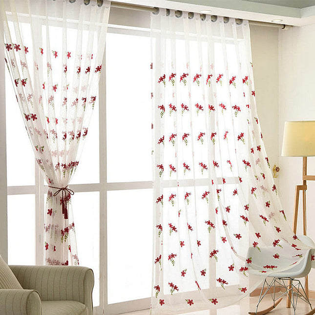 Voile ricamato con piccoli fiori rossi